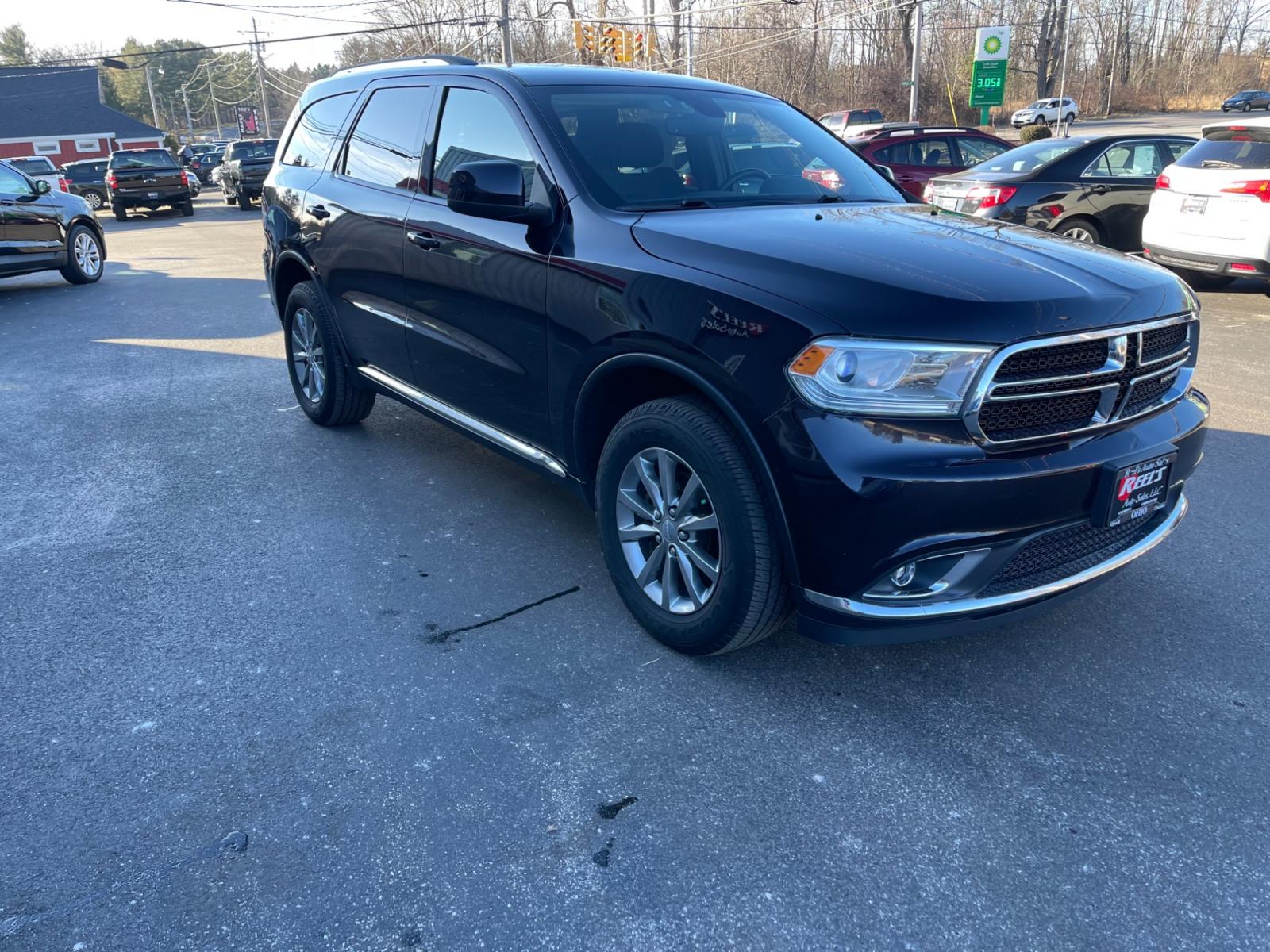 2018 Purple /Black Dodge Durango SXT Plus AWD (1C4RDJAG4JC) with an 3.6L V6 DOHC 24V engine, 8A transmission, located at 547 E. Main St., Orwell, OH, 44076, (440) 437-5893, 41.535435, -80.847855 - This 2018 Dodge Durango SXT Plus AWD is equipped with a powerful 3.6 Pentastar V6 engine paired with an 8-speed automatic transmission, offering a blend of performance and efficiency. This model features a comfortable interior with a power driver's seat, heated front seats, and a heated steering whe - Photo #2